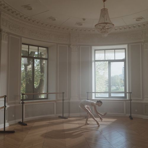 Woman practicing gentle movements in a cozy sunlit room